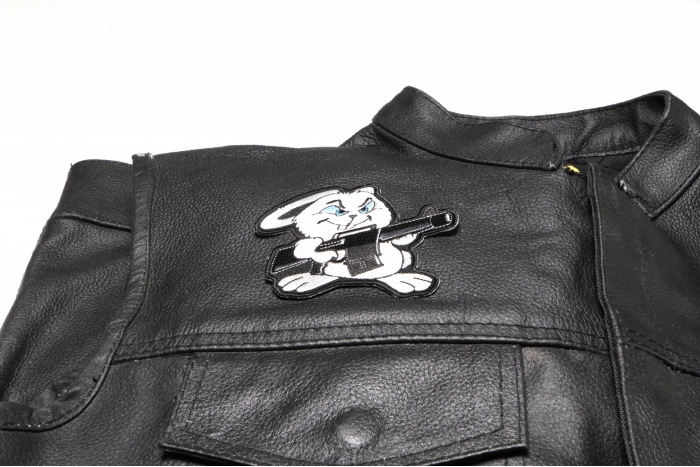 Machine Gun Bunny Rabbit Patch - 3.1x3.75 inch. Embroidered Iron on Patch shown on leather vest