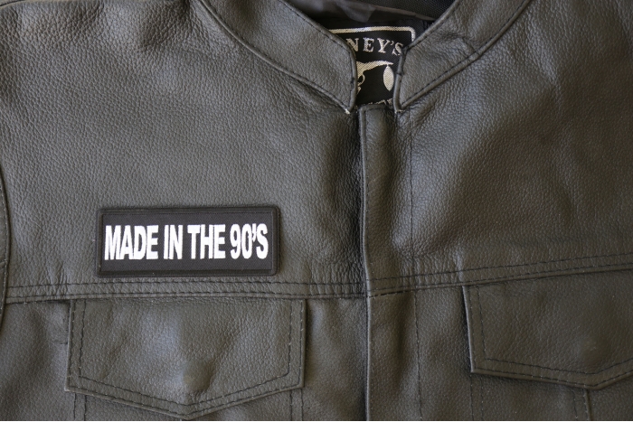 Made in the 90s Patch - 4x1.5 inch - Embroidered Iron on Patch shown on leather vest