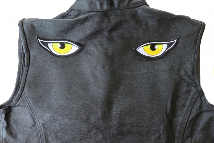 Medium Yellow Eyes Patches - 4.5x1.75 inch - Embroidered Iron on Patch shown on leather vest