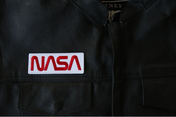 NASA Patch - 4x1.5 inch - Embroidered Iron on Patch shown on leather vest