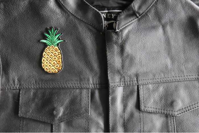 Pineapple Patch - 2x3.5 inch - Embroidered Iron on Patch shown on leather vest