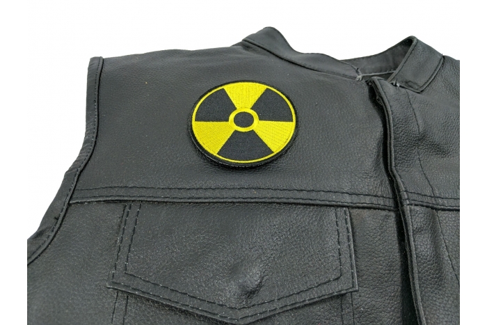 Radioactive Patch - 3 inch. Embroidered Iron on Patch shown on leather vest