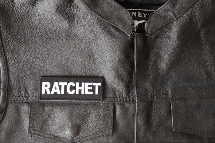 Ratchet Patch - 4x1.5 inch - Embroidered Iron on Patch shown on leather vest