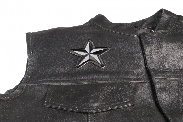 Reflective Nautical Star Patch - 3x3 inch. Embroidered Iron on Patch shown on leather vest