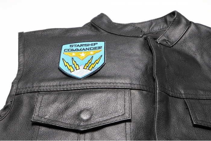 Starship Commander Patch - 2.9x3.5 inch. Embroidered Iron on Patch shown on leather vest