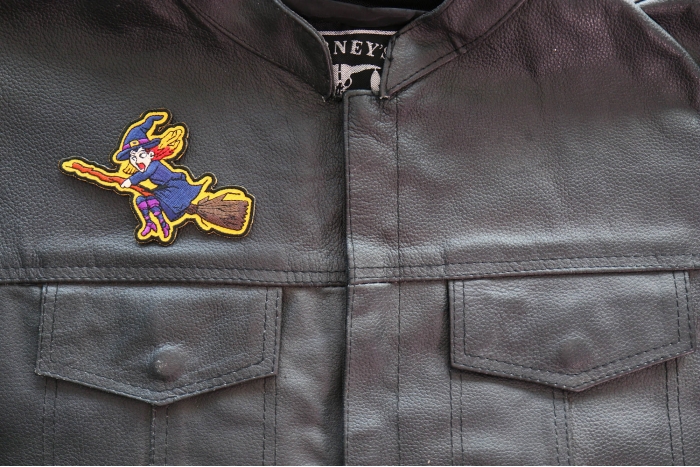 Witch on a Broom Patch shown on leather vest