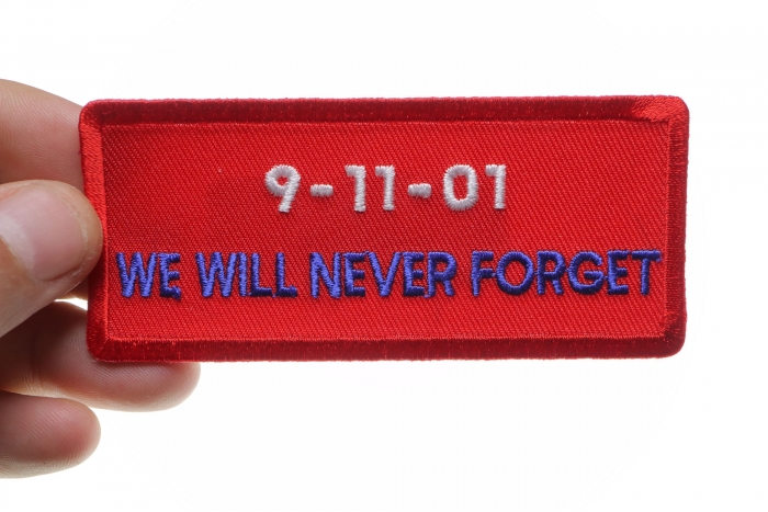 9 11 01 We Will Never Forget Patch shown on hand for size comparison