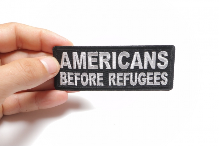 Americans Before Refugees Patriotic Iron on Patch shown on hand for size comparison