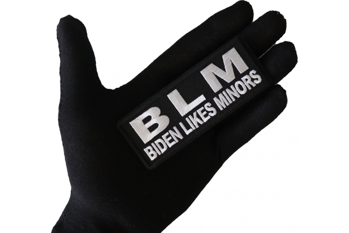 BLM Biden Likes Minors Patch shown on hand for size comparison