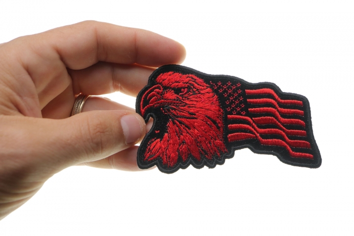 Eagle US Flag Facing Left Patriotic Iron on Patch In Red shown on hand for size comparison
