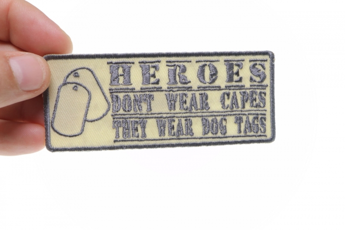 Heroes Don't Wear Capes They Wear Dog Tags Small Patriotic Iron on Patch Desert Black shown on hand for size comparison