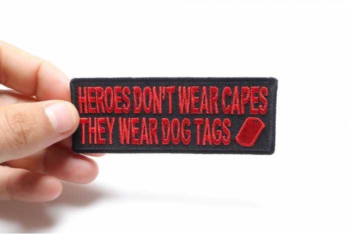 Heroes Don't Wear Capes They Wear Dog Tags Patriotic Iron on Patch In Red shown on hand for size comparison