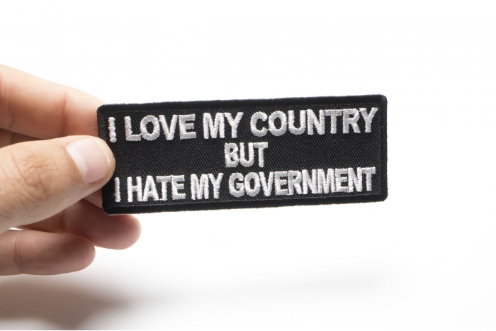 I Love My Country Hate My Government Patriotic Iron on Patch shown on hand for size comparison