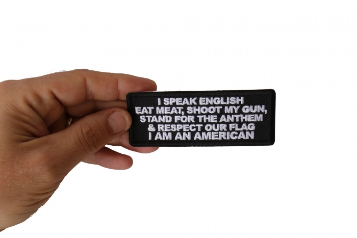 I Speak English Eat Meat Shoot my Gun Patriotic Iron on Patch shown on hand for size comparison