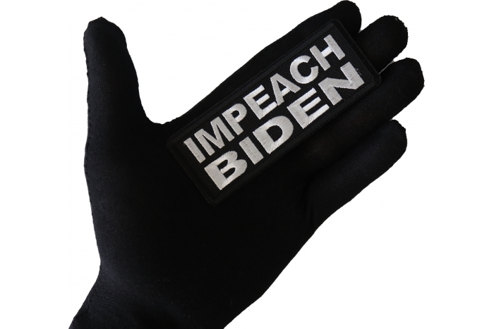 Impeach Biden Patch shown on hand for size comparison