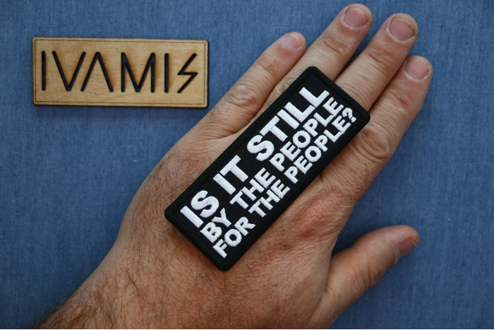 Is it Still By The People For the People Patch, Patriotic Patches shown on hand for size comparison