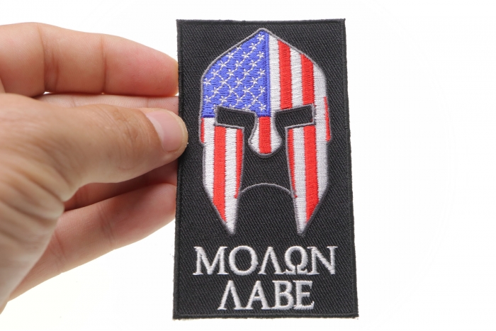 Molon Labe Spartan Patch With US Flag shown on hand for size comparison