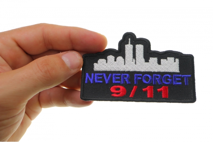 Never Forget 9 11 Patch shown on hand for size comparison