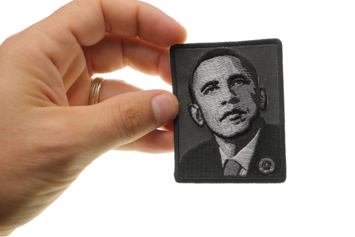 Obama Face Patch shown on hand for size comparison