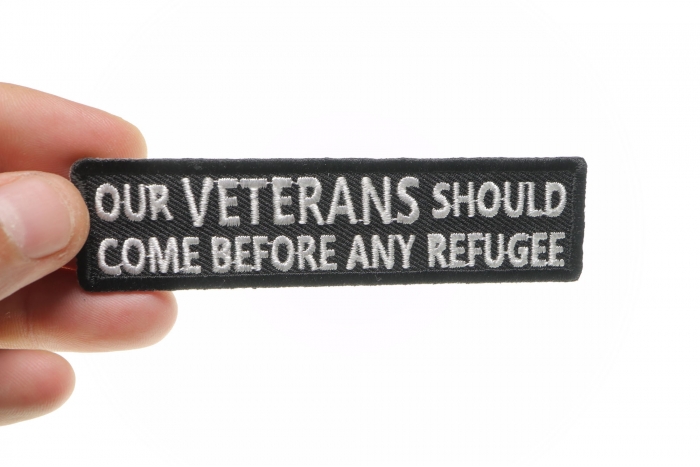 Our Veterans Should Come Before Any Refugee Patch, Military Saying Patches shown on hand for size comparison