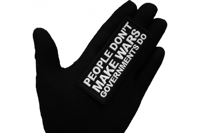 People Don't Make Wars Governments Do Iron on Patch shown on hand for size comparison