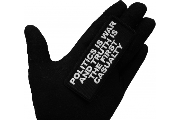 Politics is War and Truth is the First Casualty Patch, Patriotic Patches shown on hand for size comparison