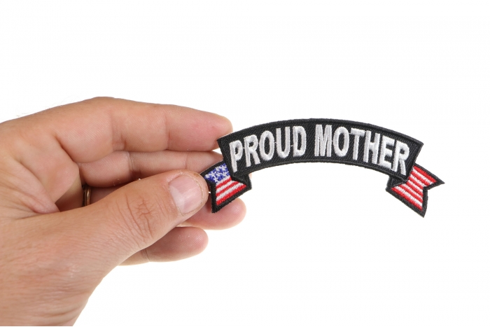 Proud Mother US Flag Rocker Patriotic Iron on Patch shown on hand for size comparison