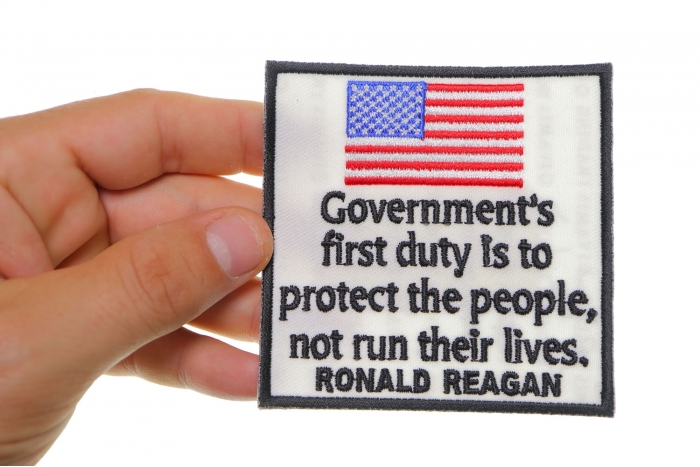 Government's First Duty is to Protect the People, Not Run Their Lives, Ronald Reagan Patriotic Iron on Patch shown on hand for size comparison