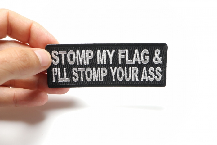 Stomp My Flag and I'll Stomp Your Ass Patch, Patriotic Saying Patches shown on hand for size comparison