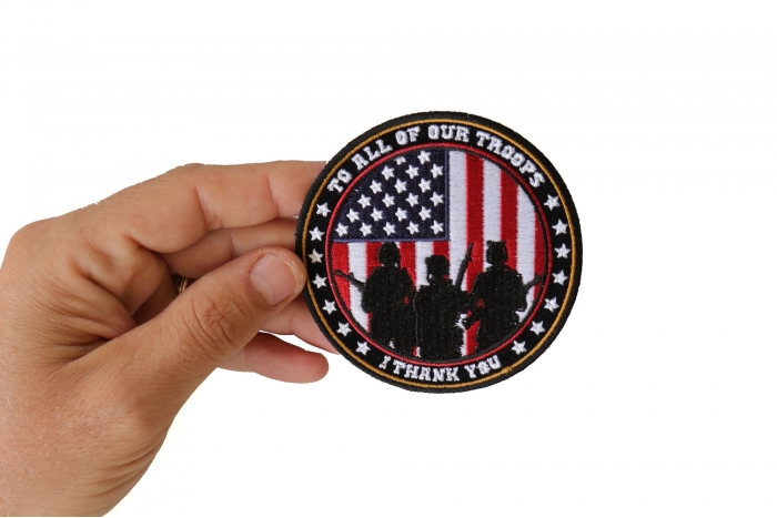 To All Our Troops I Thank You Patriotic Iron on Patch Round shown on hand for size comparison