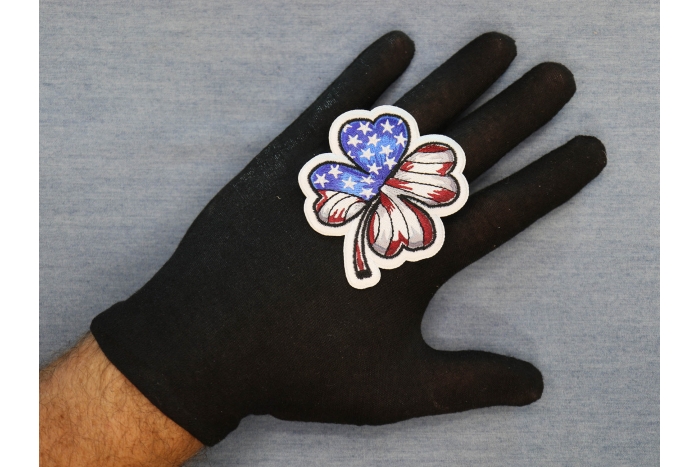 US Flag 4 Clover Leaf Patch shown on hand for size comparison
