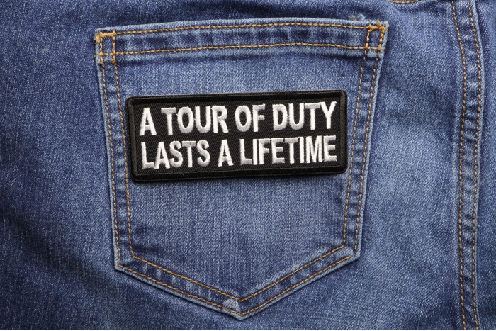 A Tour of Duty Lasts a Lifetime Patch shown on jeans