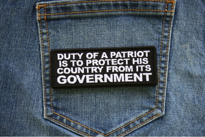 Duty of a Patriot is to Protect his Country from Its Government Patch shown on jeans