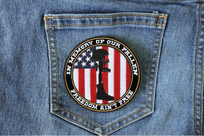 Freedom Ain't Free In Memory of Our Fallen Boot Rifle Helmet Patriotic Iron on Patch shown on jeans