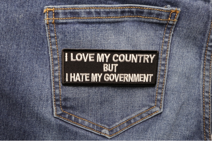 I Love My Country Hate My Government Patriotic Iron on Patch shown on jeans