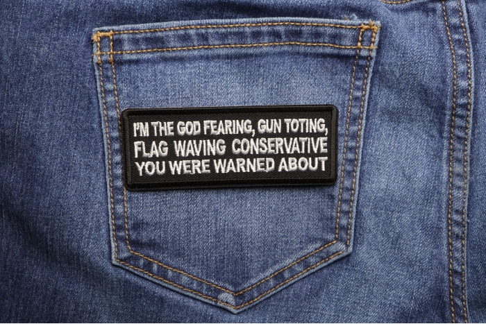 I'm The God Fearing Gun Toting Flag Waving Conservative You Were Warned About Patriotic Iron on Patch shown on jeans