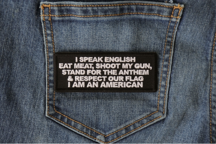 I Speak English Eat Meat Shoot my Gun Patriotic Iron on Patch shown on jeans