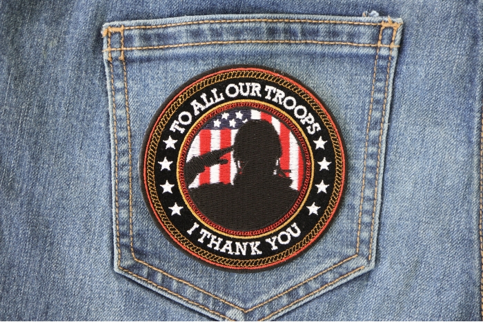 I Thank You To All Our Troops Patriotic Iron on Patch shown on jeans