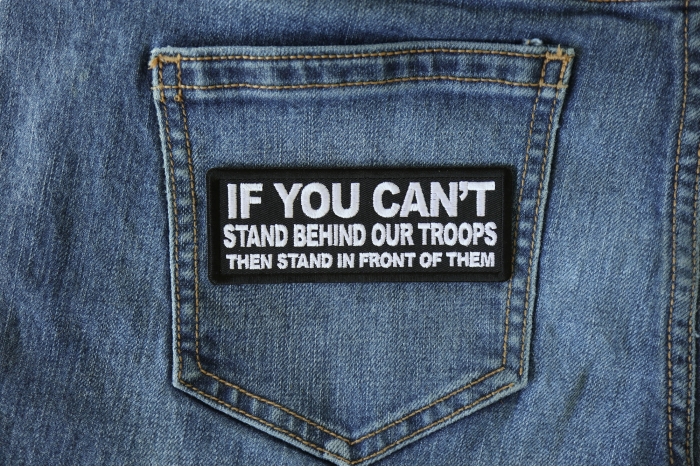 If You Can't Stand Behind Our Troops Then Stand in Front of Them Patch shown on jeans