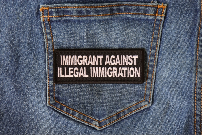 Immigrant Against Illegal Immigration Patriotic Iron on Patch shown on jeans