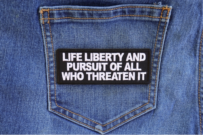 Life Liberty and Pursuit of All Who Threaten it Patriotic Iron on Patch shown on jeans