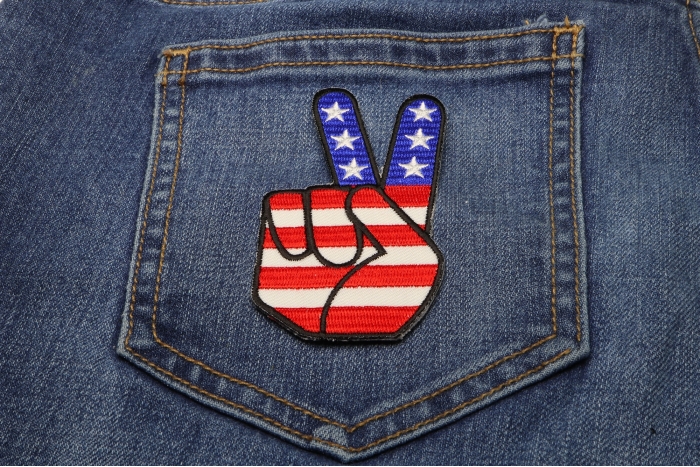 Peace Hand Sign with American Flag Patriotic Iron on Patch shown on jeans