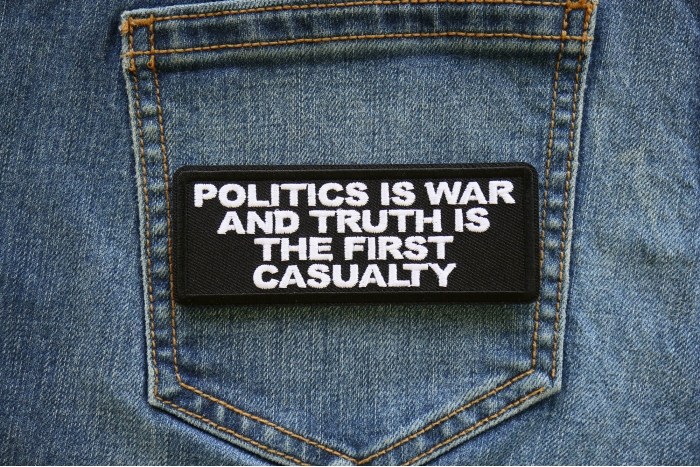 Politics is War and Truth is the First Casualty Patch shown on jeans
