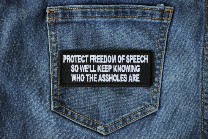 Protect Freedom of Speech so We'll Keep Knowing Who the Assholes Are Patriotic Iron on Patch shown on jeans