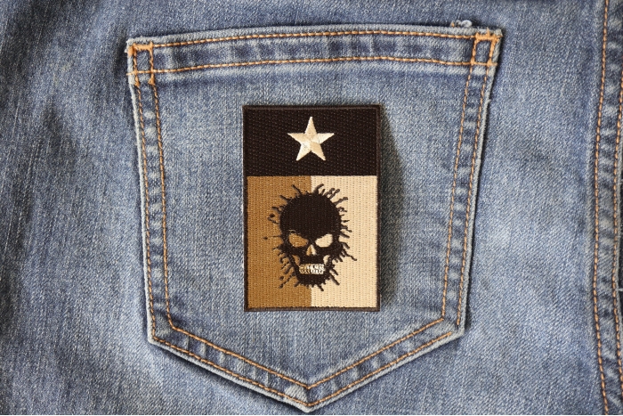 Texas Flag Oil Spill Skull Patch shown on jeans