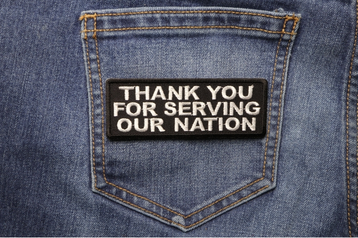 Thank You For Serving Our Nation Patriotic Iron on Patch shown on jeans