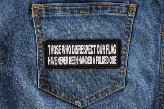 Those Who Disrespect Our Flag Have Never Been Handed a Folded One Patch shown on jeans