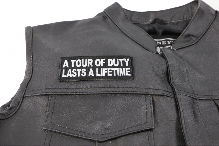 A Tour of Duty Lasts a Lifetime Patch, Military Saying Patches shown on leather vest