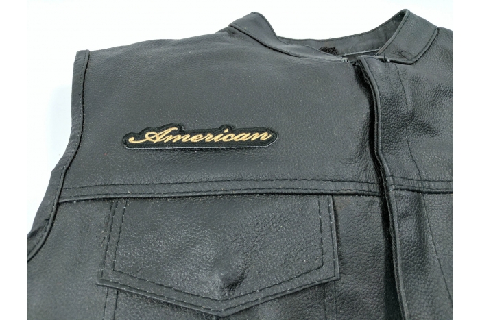 American Patch Small - 4x0.75 inch. Embroidered Iron on Patch shown on leather vest