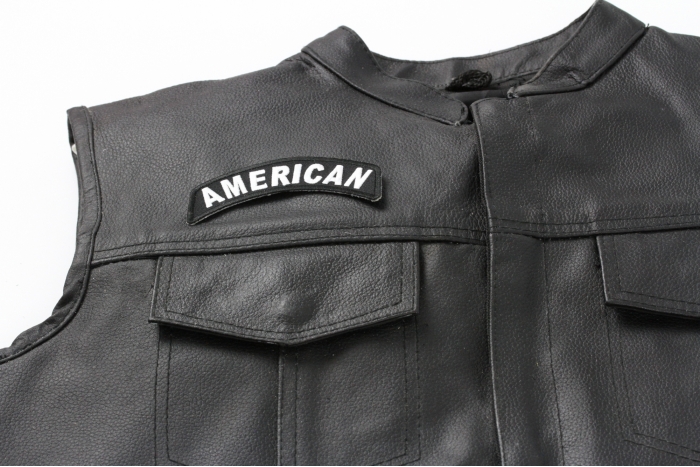 American Rocker Patch - 4x1.5 inch. Embroidered Iron on Patch shown on leather vest